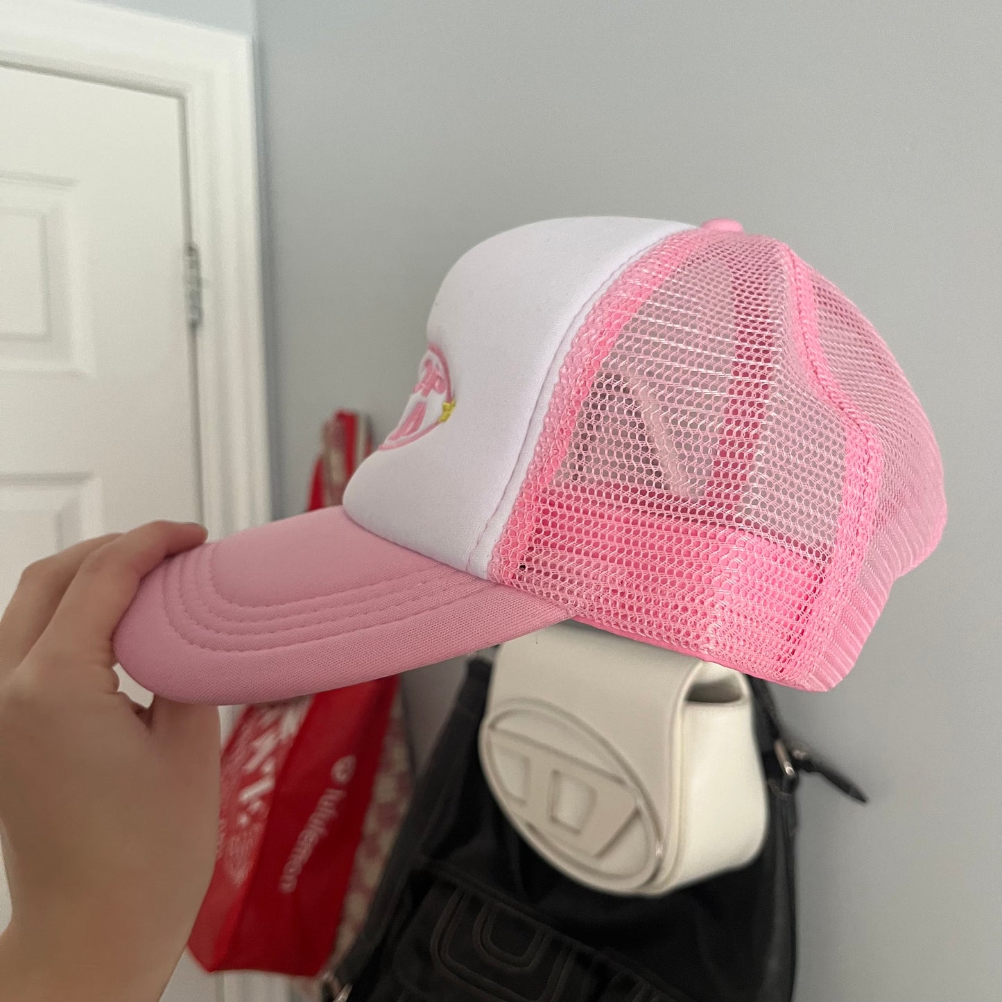 flop era trucker hat in pink