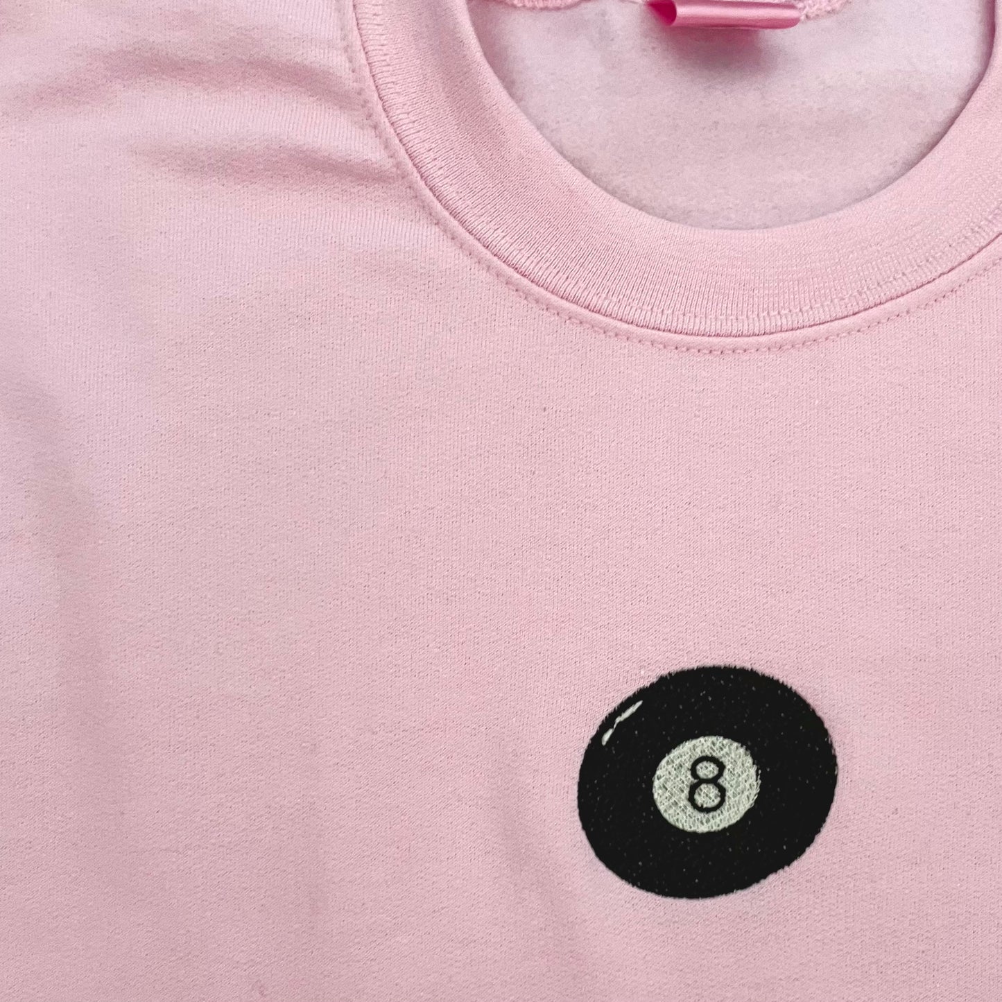 pink embroidered 8 ball crewneck